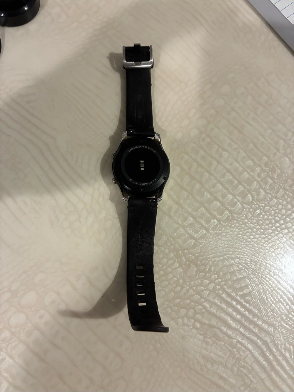 Samsung Silver Smartwatch with Black Strap and Blue Display